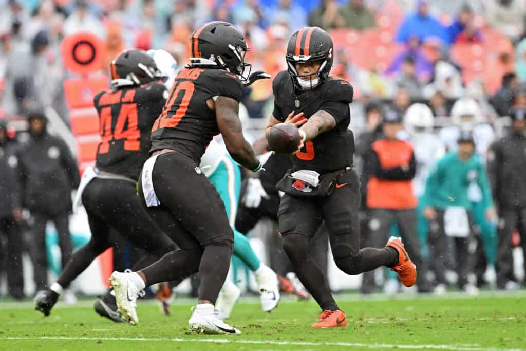 CLEVELAND, OHIO - OCTOBER 19: Dillon Gabriel #8 of the Cleveland Browns hands off the ball to teammate Quinshon Judkins #10 during the first quarter against the Miami Dolphins at Huntington Bank Field on October 19, 2025 in Cleveland, Ohio.