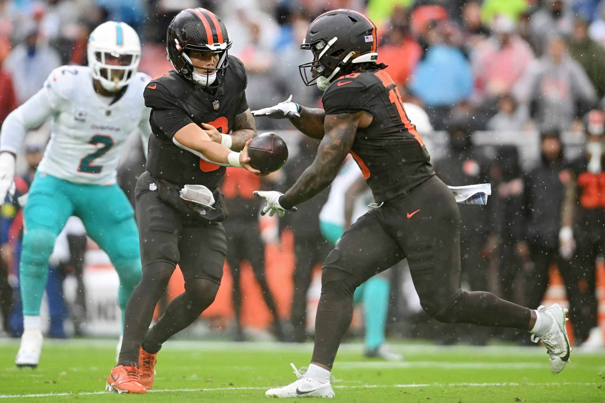 CLEVELAND, OHIO - OCTOBER 19: Dillon Gabriel #8 of the Cleveland Browns hands off the ball to teammate Quinshon Judkins #10 during the first quarter against the Miami Dolphins at Huntington Bank Field on October 19, 2025 in Cleveland, Ohio.