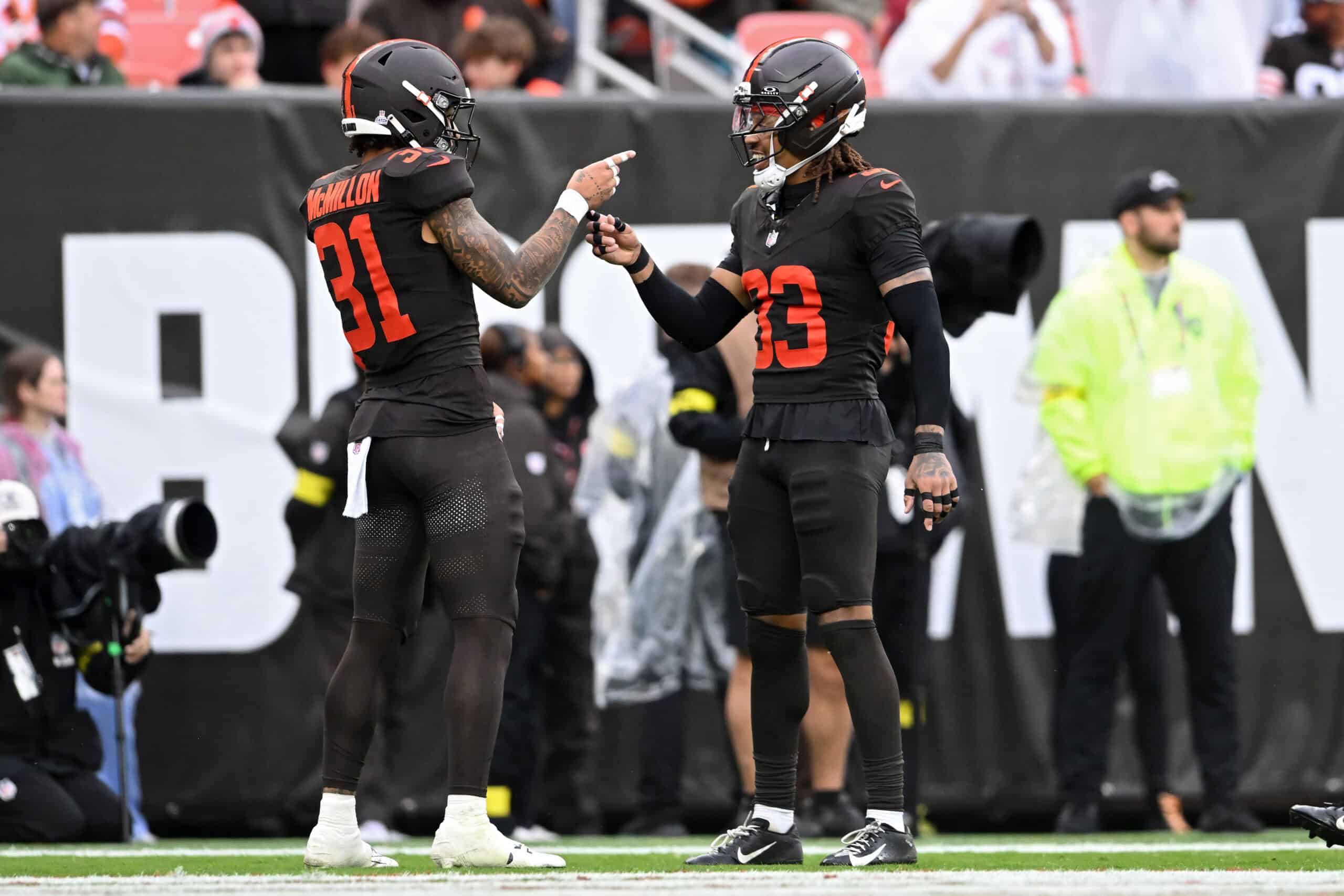 CLEVELAND, OHIO - OCTOBER 19: Donovan McMillon #31 and Ronnie Hickman Jr. #33 of the Cleveland Browns celebrate after a play against the Miami Dolphins during the second half of the game at Huntington Bank Field on October 19, 2025 in Cleveland, Ohio.