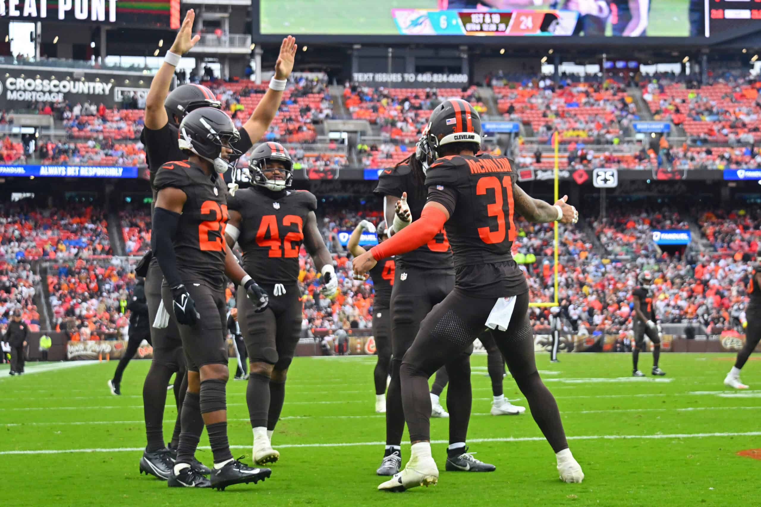 CLEVELAND, OHIO - OCTOBER 19: Donovan McMillon #31 of the Cleveland Browns celebrates with teamamtes after a play against the Miami Dolphins during the second half of the game at Huntington Bank Field on October 19, 2025 in Cleveland, Ohio.