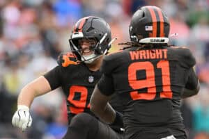 CLEVELAND, OHIO - OCTOBER 19: Mason Graham #94 and Alex Wright #91 of the Cleveland Browns celebrate after a tackle in the fourth quarter of a game against the Miami Dolphins at Huntington Bank Field on October 19, 2025 in Cleveland, Ohio.