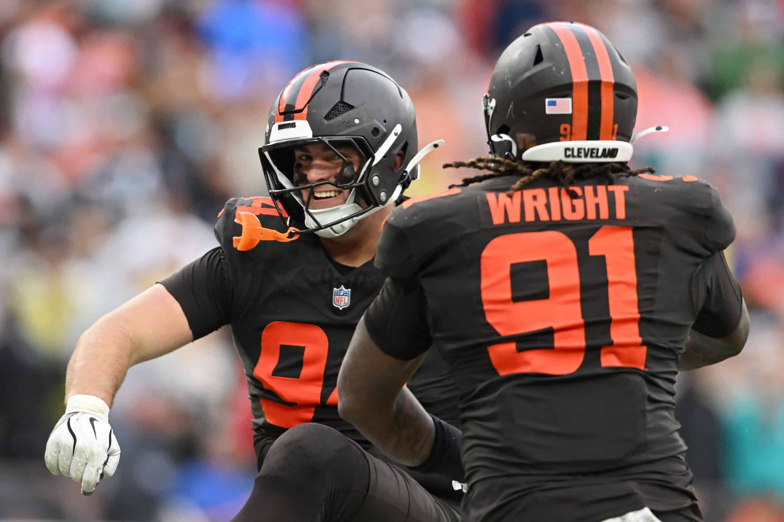CLEVELAND, OHIO - OCTOBER 19: Mason Graham #94 and Alex Wright #91 of the Cleveland Browns celebrate after a tackle in the fourth quarter of a game against the Miami Dolphins at Huntington Bank Field on October 19, 2025 in Cleveland, Ohio.