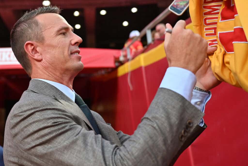 KANSAS CITY, MISSOURI - SEPTEMBER 28: Former NFL player Matt Ryan signs autographs following a game between the Baltimore Ravens and Kansas City Chiefs at Arrowhead Stadium on September 28, 2025 in Kansas City, Missouri.