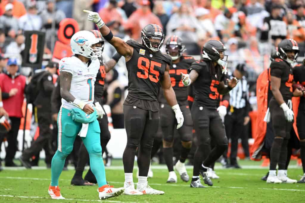 CLEVELAND, OHIO - OCTOBER 19: Myles Garrett #95 of the Cleveland Browns celebrates after his team's interception against the Miami Dolphins in the fourth quarter of a game at Huntington Bank Field on October 19, 2025 in Cleveland, Ohio.