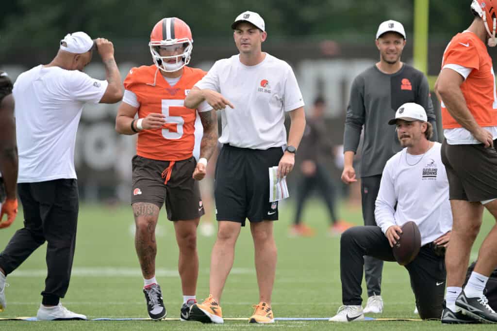 BEREA, OHIO - JULY 25: Offensive coordinator Tommy Rees works with quarterback Dillon Gabriel #5 of the Cleveland Browns during training camp at CrossCountry Mortgage Campus on July 25, 2025 in Berea, Ohio.