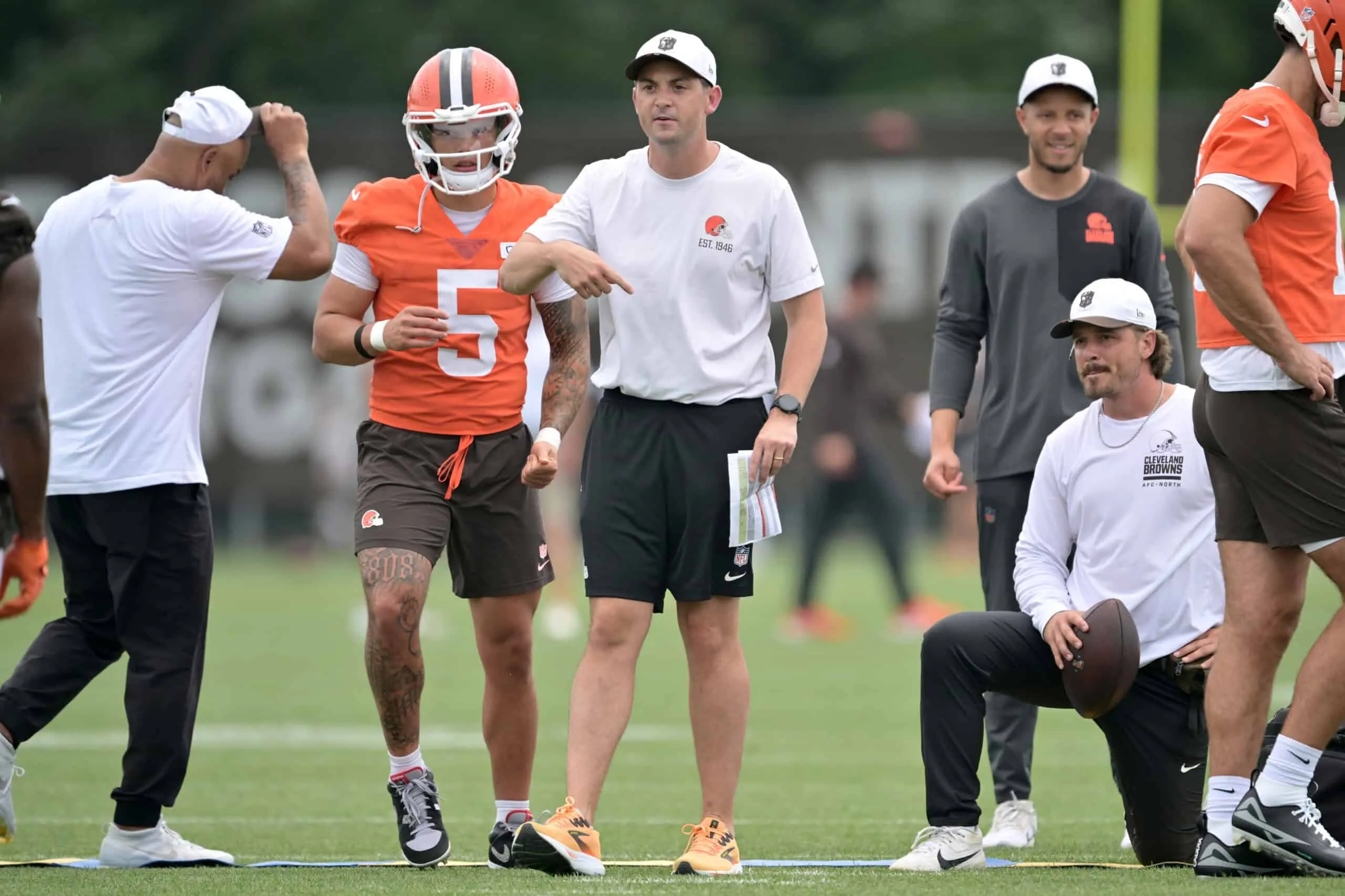 BEREA, OHIO - JULY 25: Offensive coordinator Tommy Rees works with quarterback Dillon Gabriel #5 of the Cleveland Browns during training camp at CrossCountry Mortgage Campus on July 25, 2025 in Berea, Ohio.