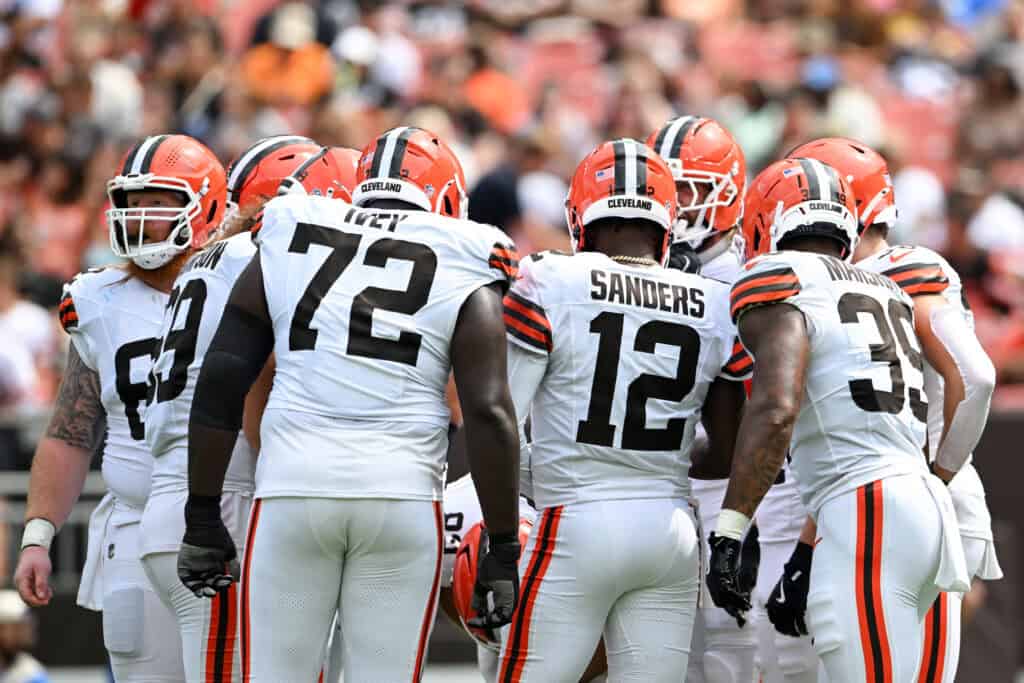 CLEVELAND, OHIO - AUGUST 23: Shedeur Sanders #12 of the Cleveland Browns delivers a play call to the offense during the third quarter of an NFL Preseason 2025 game against the Los Angeles Rams at Huntington Bank Field on August 23, 2025 in Cleveland, Ohio.