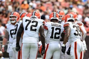 CLEVELAND, OHIO - AUGUST 23: Shedeur Sanders #12 of the Cleveland Browns delivers a play call to the offense during the third quarter of an NFL Preseason 2025 game against the Los Angeles Rams at Huntington Bank Field on August 23, 2025 in Cleveland, Ohio.