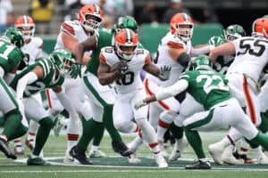 EAST RUTHERFORD, NEW JERSEY - NOVEMBER 09: Quinshon Judkins #10 of the Cleveland Browns carries the ball against Tony Adams #22 of the New York Jets during the first half in the game at MetLife Stadium on November 09, 2025 in East Rutherford, New Jersey.