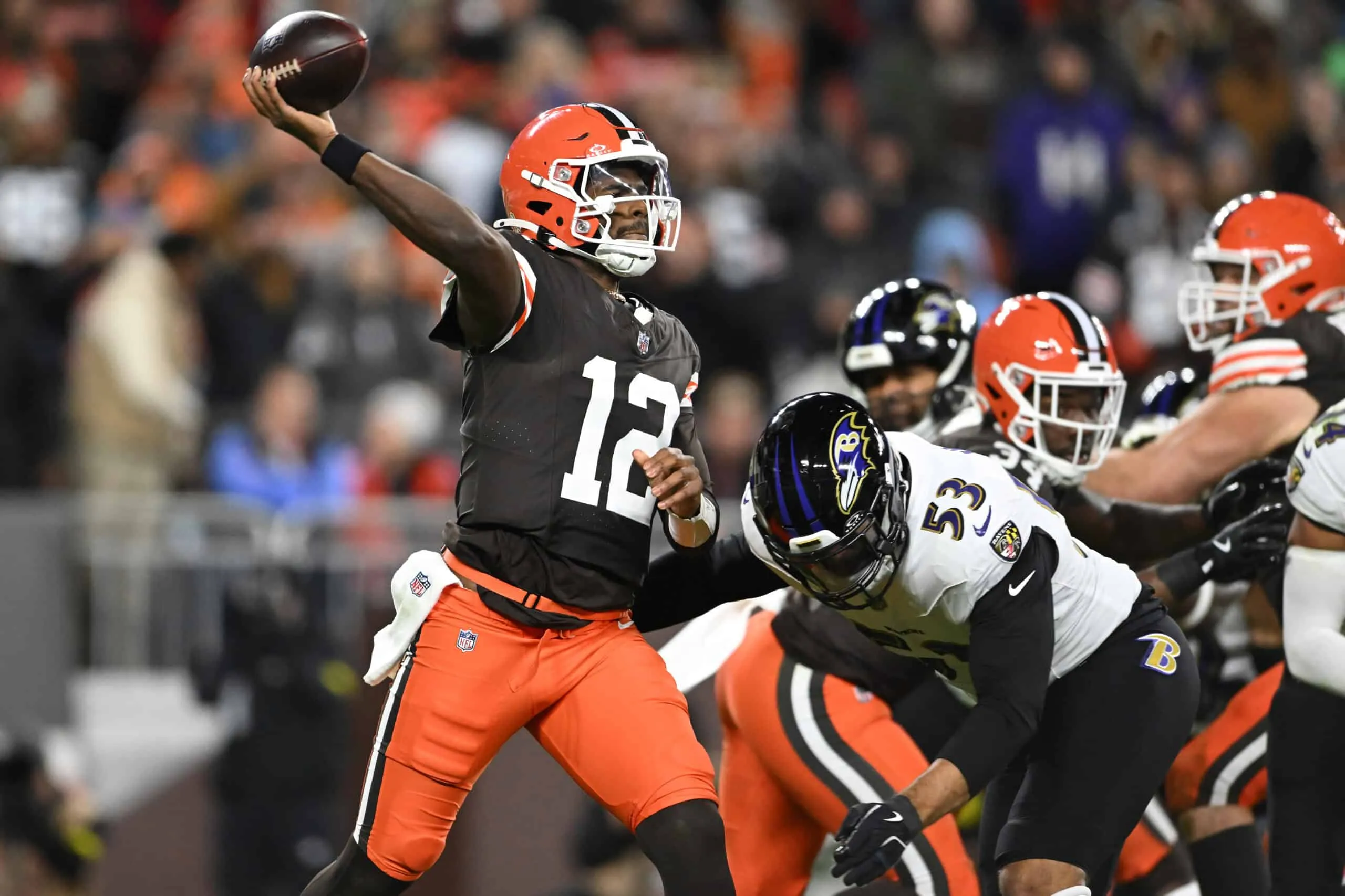 CLEVELAND, OHIO - NOVEMBER 16: Shedeur Sanders #12 of the Cleveland Browns makes a pass while under pressure against Kyle Van Noy #53 of the Baltimore Ravens in the game at Huntington Bank Field on November 16, 2025 in Cleveland, Ohio.