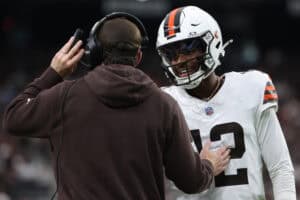 LAS VEGAS, NEVADA - NOVEMBER 23: Shedeur Sanders #12 of the Cleveland Browns talks to head coach Kevin Stefanski during the second quarter against the Las Vegas Raiders at Allegiant Stadium on November 23, 2025 in Las Vegas, Nevada.