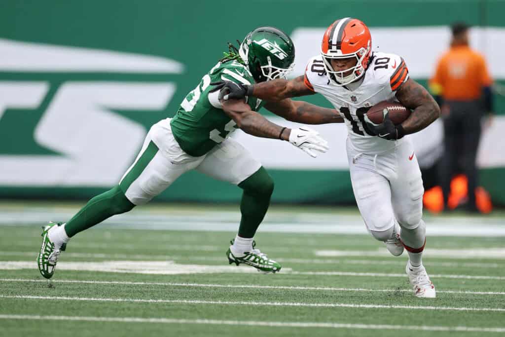 EAST RUTHERFORD, NEW JERSEY - NOVEMBER 09: Quinshon Judkins #10 of the Cleveland Browns runs the ball against Quincy Williams #56 of the New York Jets during the first half in the game at MetLife Stadium on November 09, 2025 in East Rutherford, New Jersey.