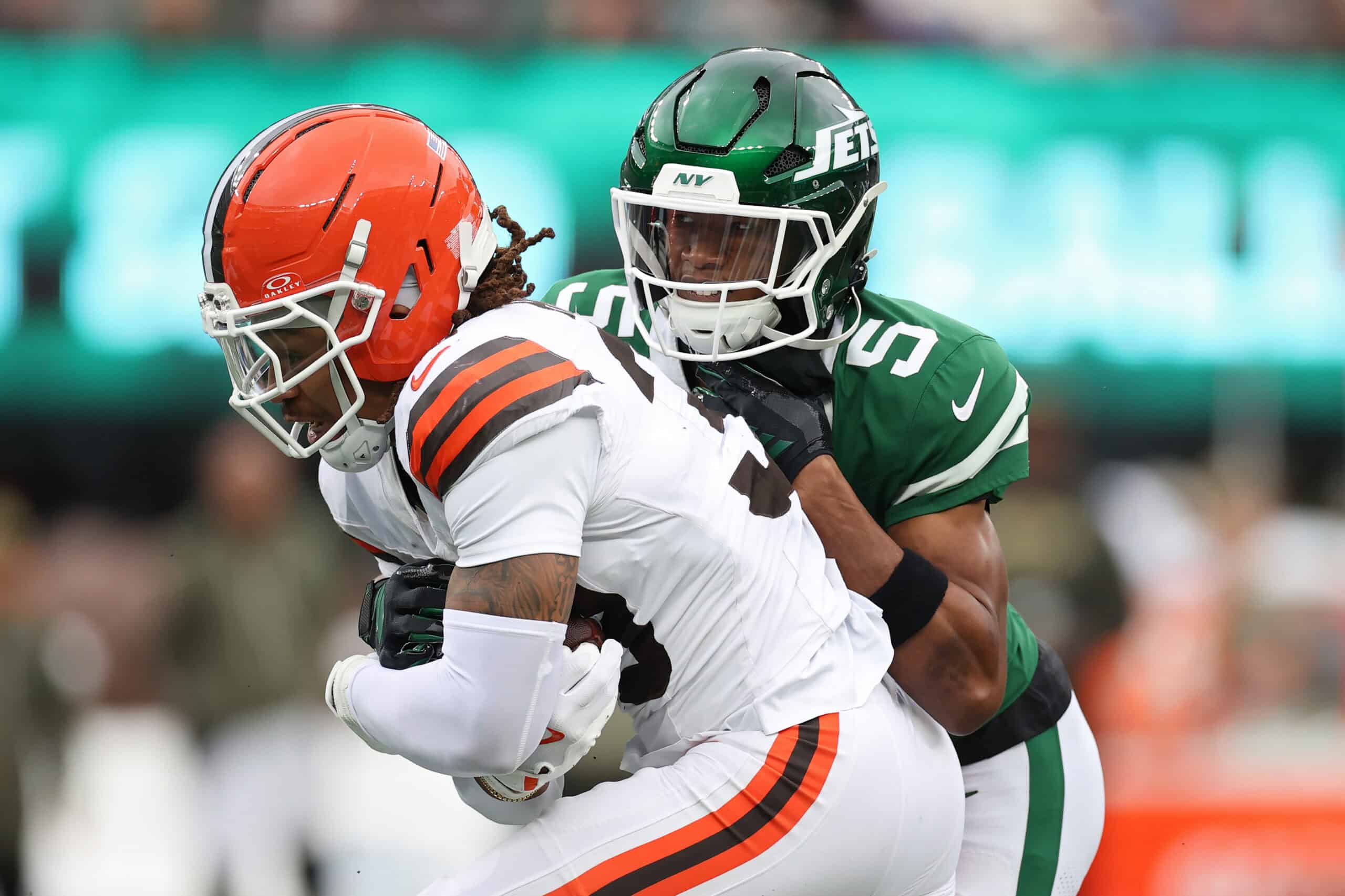 EAST RUTHERFORD, NEW JERSEY - NOVEMBER 09: Devin Bush #30 of the Cleveland Browns intercepts the ball against Garrett Wilson #5 of the New York Jets during the first half in the game at MetLife Stadium on November 09, 2025 in East Rutherford, New Jersey.