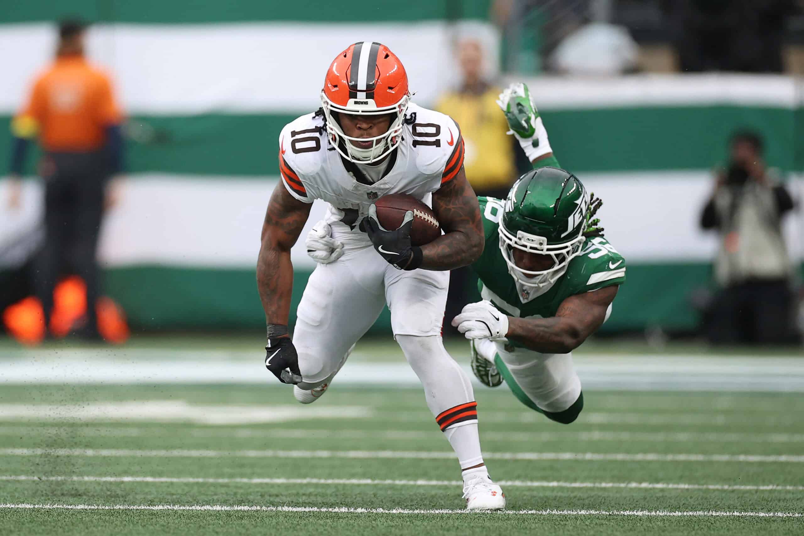 EAST RUTHERFORD, NEW JERSEY - NOVEMBER 09: Quinshon Judkins #10 of the Cleveland Browns is tackled by Quincy Williams #56 of the New York Jets during the second quarter in the game at MetLife Stadium on November 09, 2025 in East Rutherford, New Jersey.