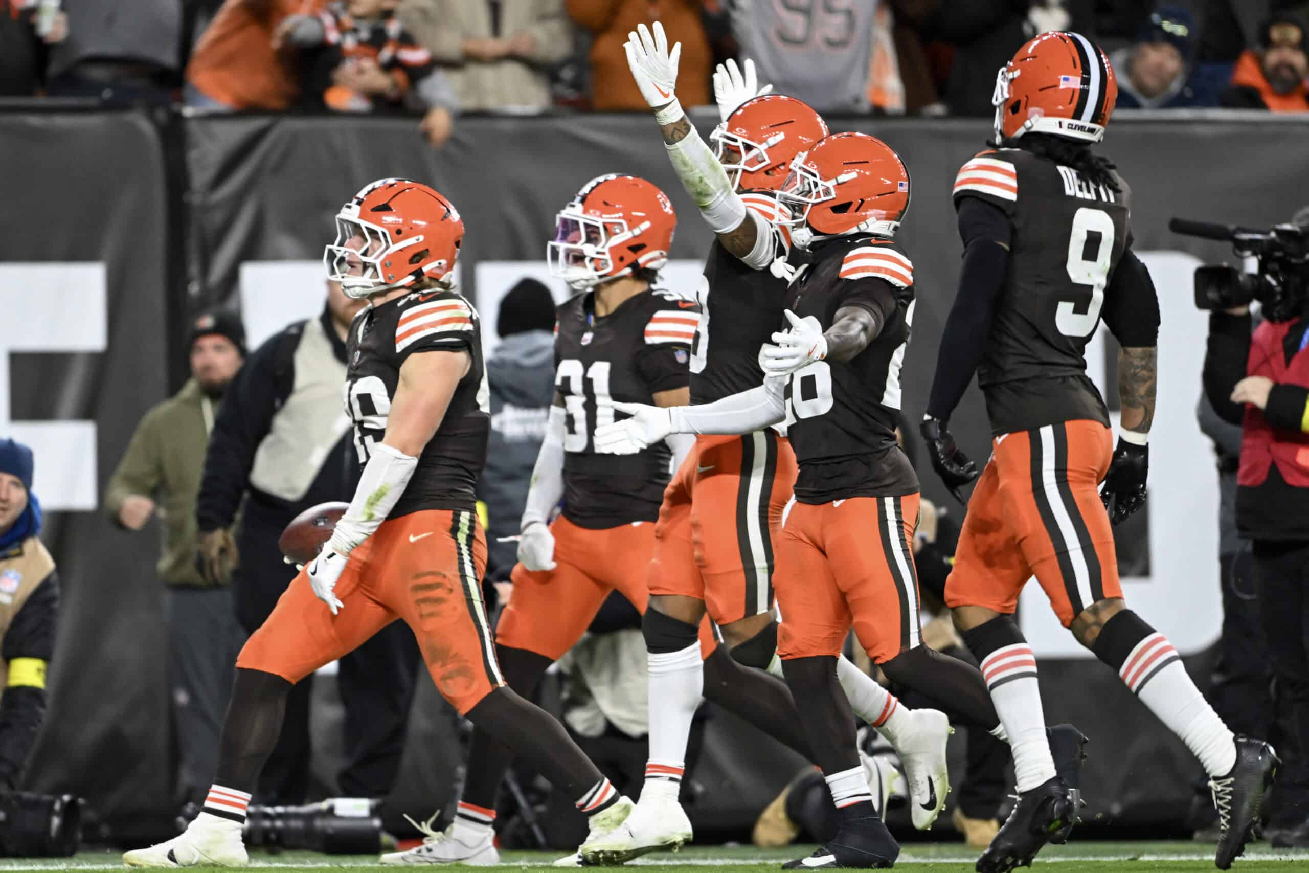 CLEVELAND, OHIO - NOVEMBER 16: Carson Schwesinger #49 of the Cleveland Browns celebrates after an interception against the Baltimore Ravens with teammates during the third quarter at Huntington Bank Field on November 16, 2025 in Cleveland, Ohio.