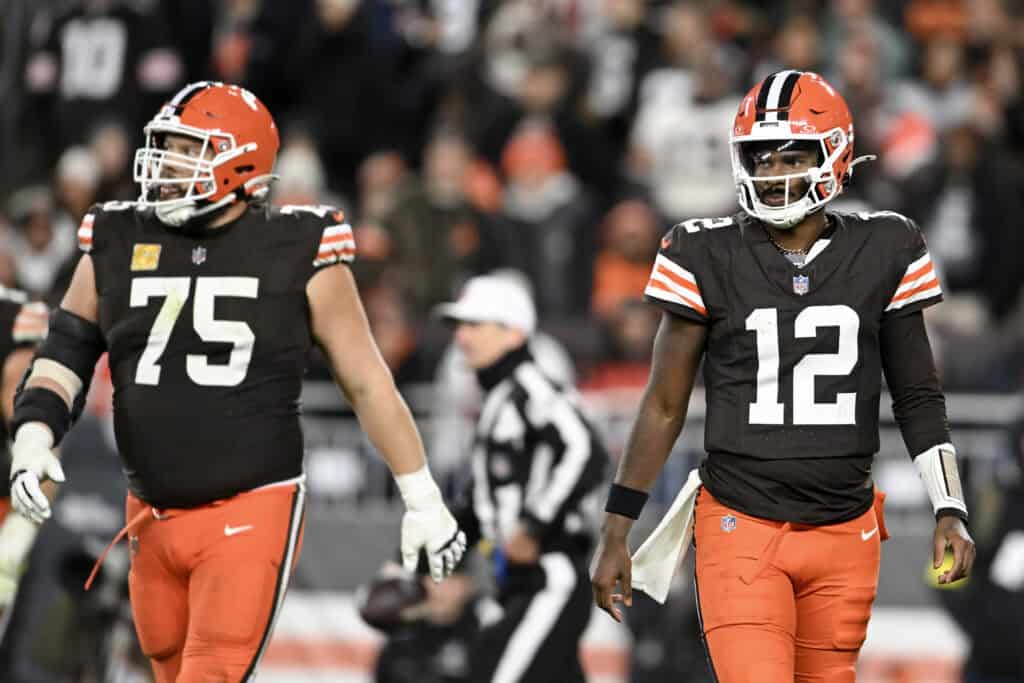 CLEVELAND, OHIO - NOVEMBER 16: (L-R) Joel Bitonio #75 and Shedeur Sanders #12 of the Cleveland Browns look on during the second half against the Baltimore Ravens at Huntington Bank Field on November 16, 2025 in Cleveland, Ohio.