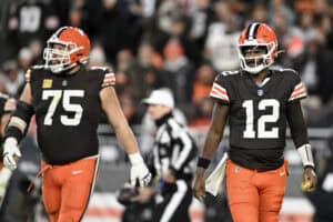CLEVELAND, OHIO - NOVEMBER 16: (L-R) Joel Bitonio #75 and Shedeur Sanders #12 of the Cleveland Browns look on during the second half against the Baltimore Ravens at Huntington Bank Field on November 16, 2025 in Cleveland, Ohio.