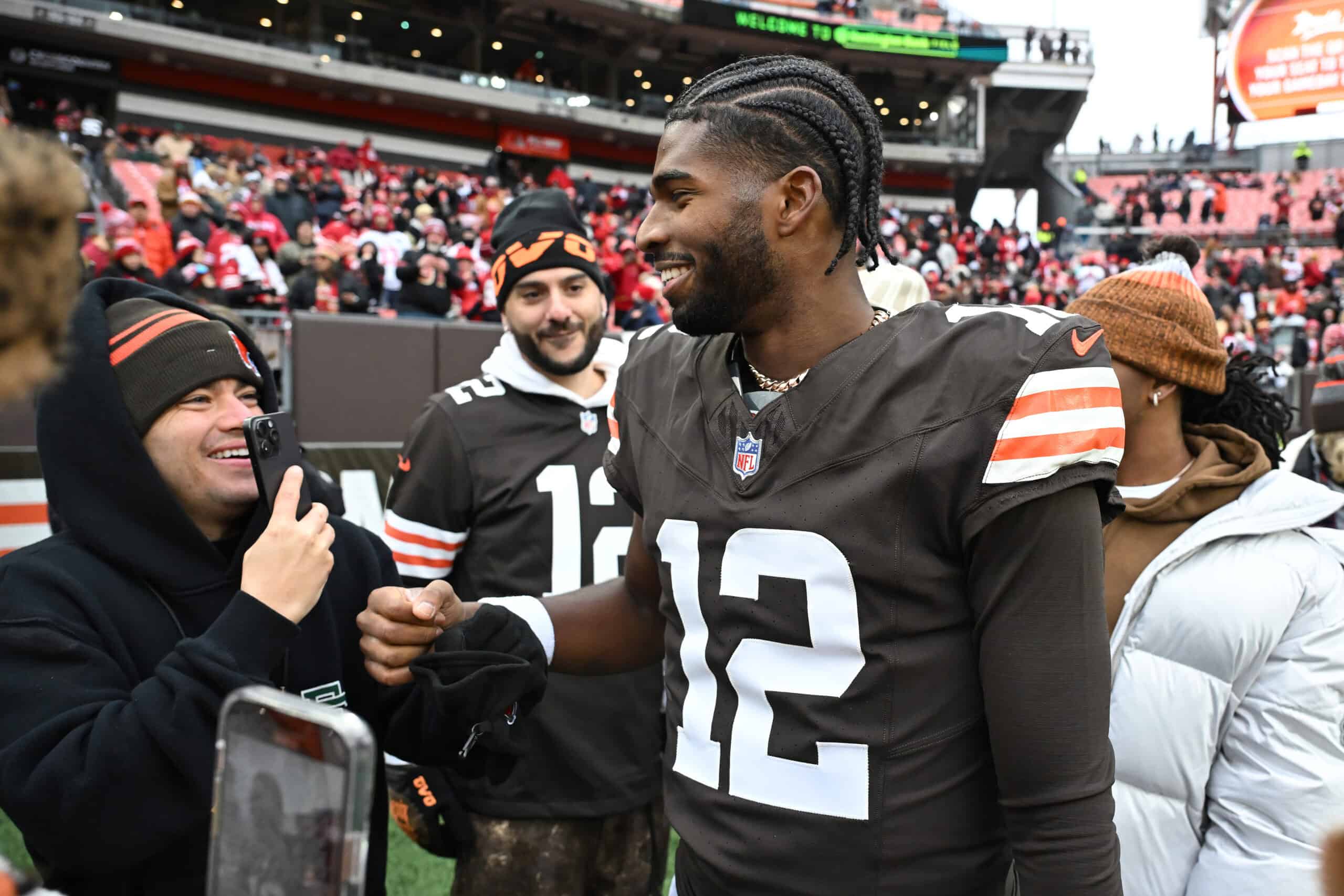 CLEVELAND, OHIO - NOVEMBER 30: Shedeur Sanders #12 of the Cleveland Browns interacts with fans before the game against the San Francisco 49ers at Huntington Bank Field on November 30, 2025 in Cleveland, Ohio