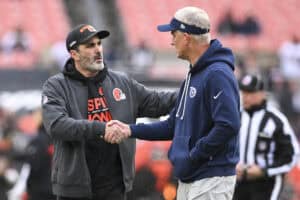 CLEVELAND, OHIO - DECEMBER 07: Head coach Kevin Stefanski of the Cleveland Browns and interim head coach Mike McCoy of the Tennessee Titans meet prior to a game at Huntington Bank Field on December 07, 2025 in Cleveland, Ohio.