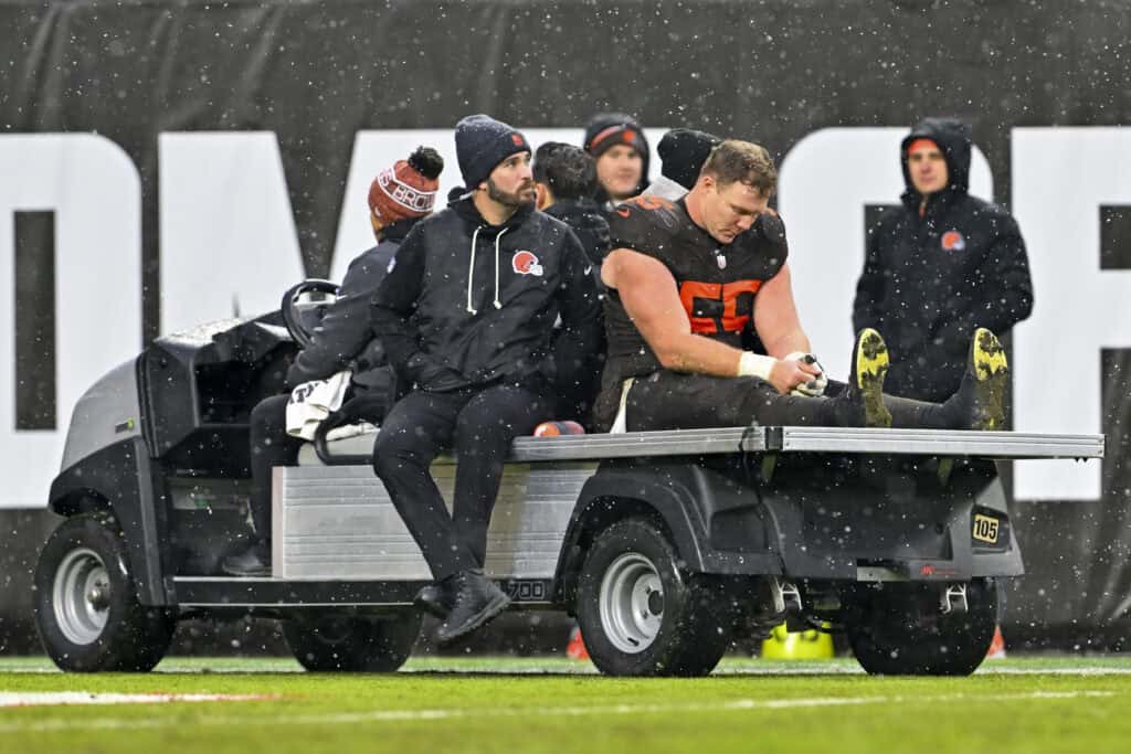 CLEVELAND, OHIO - DECEMBER 07: Ethan Pocic #55 of the Cleveland Browns is carted of the field during the fourth quarter against the Tennessee Titans at Huntington Bank Field on December 07, 2025 in Cleveland, Ohio.