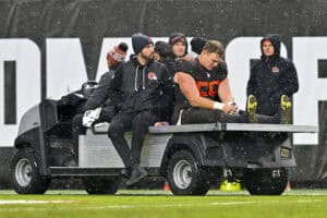 CLEVELAND, OHIO - DECEMBER 07: Ethan Pocic #55 of the Cleveland Browns is carted of the field during the fourth quarter against the Tennessee Titans at Huntington Bank Field on December 07, 2025 in Cleveland, Ohio.