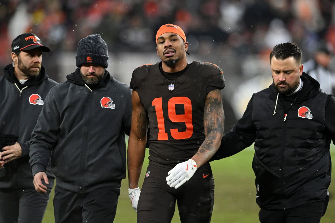 CLEVELAND, OHIO - DECEMBER 07: Cedric Tillman #19 of the Cleveland Browns is helped off the field after being injured during the fourth quarter against the Tennessee Titans at Huntington Bank Field on December 07, 2025 in Cleveland, Ohio.