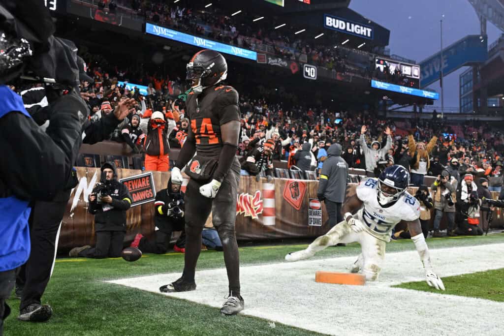 CLEVELAND, OHIO - DECEMBER 07: Harold Fannin Jr. #44 of the Cleveland Browns celebrates after catcheinga pass in front of Xavier Woods #25 of the Tennessee Titans for a touchdown during the fourth quarter at Huntington Bank Field on December 07, 2025 in Cleveland, Ohio.