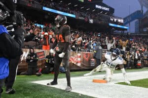 CLEVELAND, OHIO - DECEMBER 07: Harold Fannin Jr. #44 of the Cleveland Browns celebrates after catcheinga pass in front of Xavier Woods #25 of the Tennessee Titans for a touchdown during the fourth quarter at Huntington Bank Field on December 07, 2025 in Cleveland, Ohio.