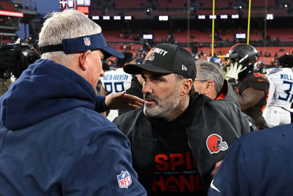 CLEVELAND, OHIO - DECEMBER 07: Head coach Kevin Stefanski of the Cleveland Browns and interim head coach Mike McCoy of the Tennessee Titans meet after the game at Huntington Bank Field on December 07, 2025 in Cleveland, Ohio.