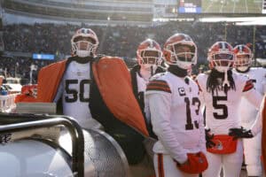 CHICAGO, ILLINOIS - DECEMBER 14: The Cleveland Browns huddle around the heater during the first quarter of a game against the Chicago Bears at Soldier Field on December 14, 2025 in Chicago, Illinois.