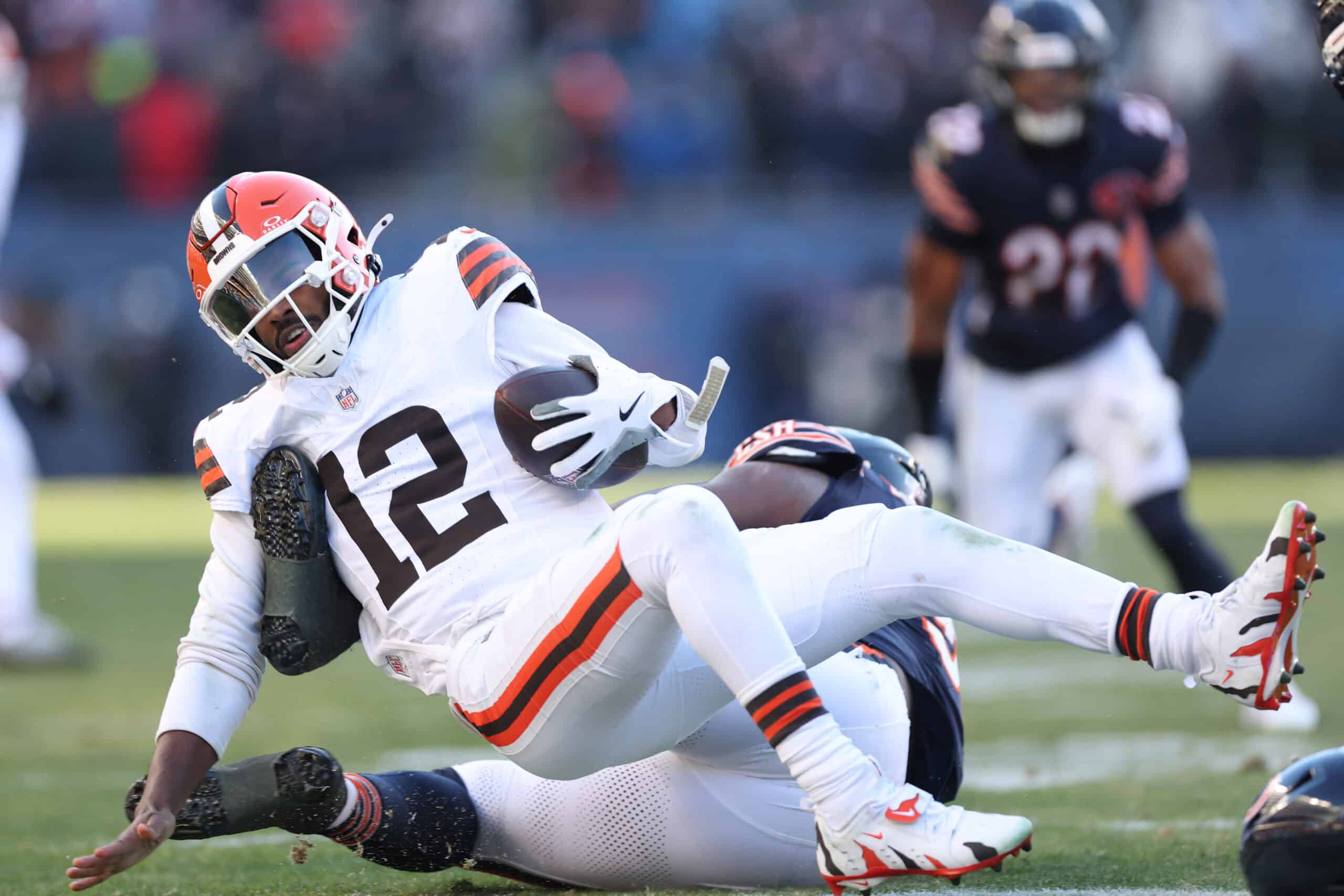 CHICAGO, ILLINOIS - DECEMBER 14: Shedeur Sanders #12 of the Cleveland Browns is sacked during the third quarter against the Chicago Bears at Soldier Field on December 14, 2025 in Chicago, Illinois.