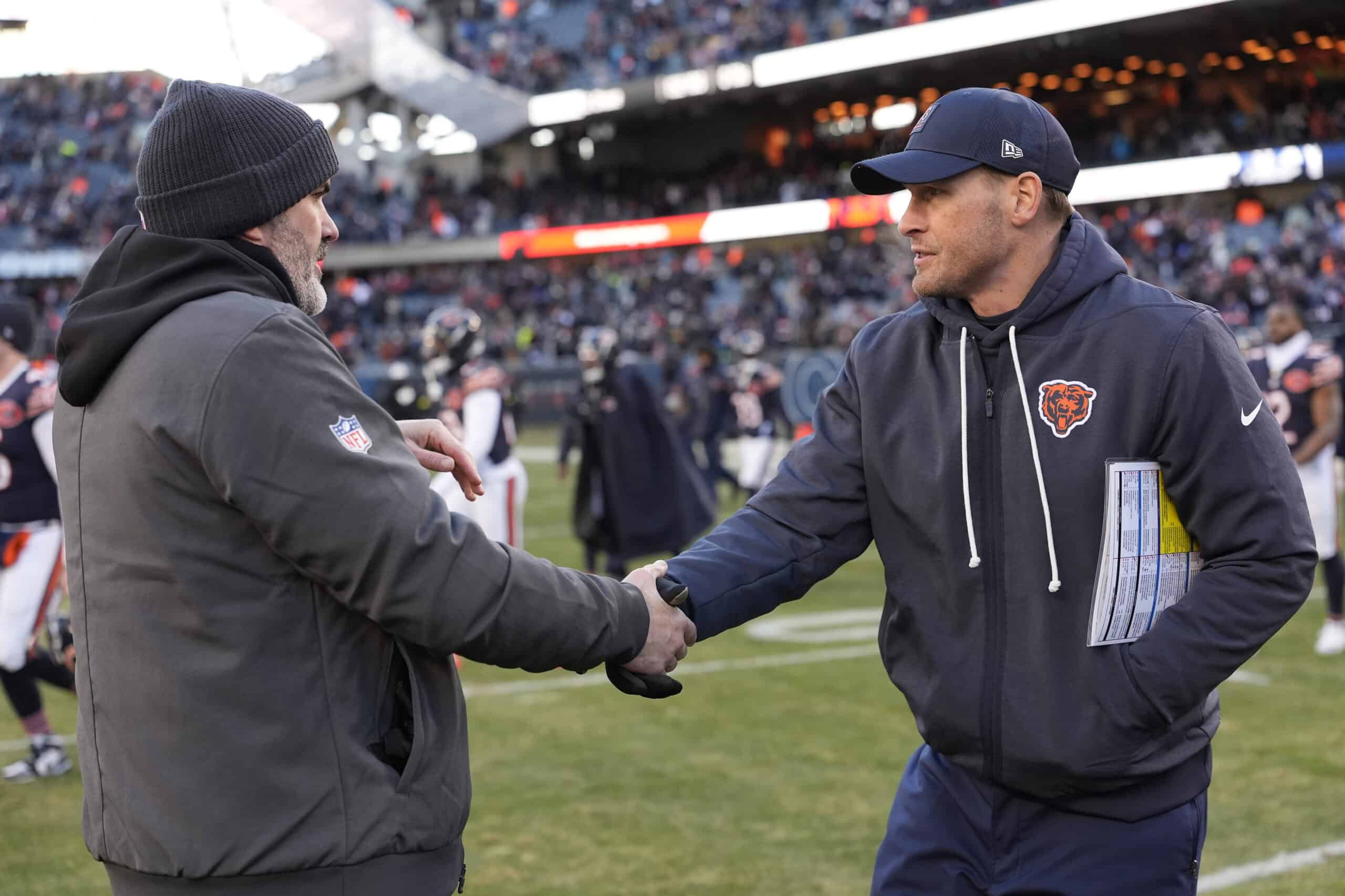 CHICAGO, ILLINOIS - DECEMBER 14: Ben Johnson of the Chicago Bears and Kevin Stefanski of the Cleveland Browns meet after the Bears beat the Browns 31-3 on December 14, 2025 in Chicago, Illinois.