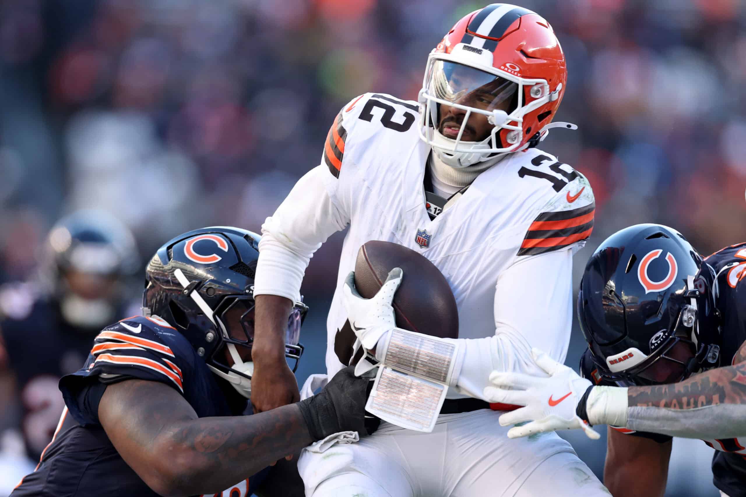 CHICAGO, ILLINOIS - DECEMBER 14: Shedeur Sanders #12 of the Cleveland Browns is sacked during the third quarter against the Chicago Bears at Soldier Field on December 14, 2025 in Chicago, Illinois.