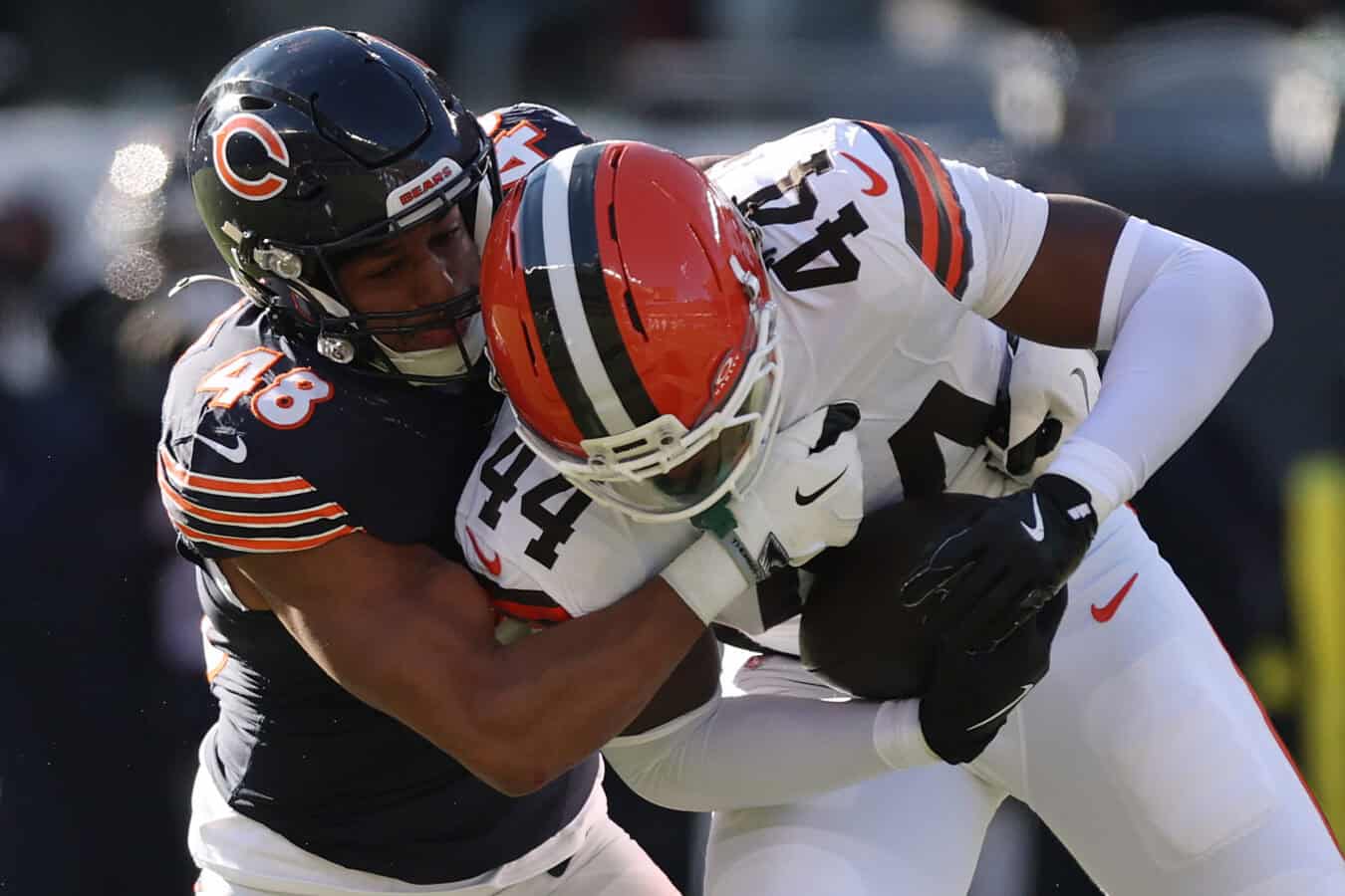 CHICAGO, ILLINOIS - DECEMBER 14: D'Marco Jackson #48 of the Chicago Bears tackles Harold Fannin Jr. #44 of the Cleveland Browns at Soldier Field on December 14, 2025 in Chicago, Illinois