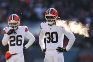 CHICAGO, ILLINOIS - DECEMBER 14: Myles Harden #26 and Devin Bush #30 of the Cleveland Browns look on against the Chicago Bears at Soldier Field on December 14, 2025 in Chicago, Illinois