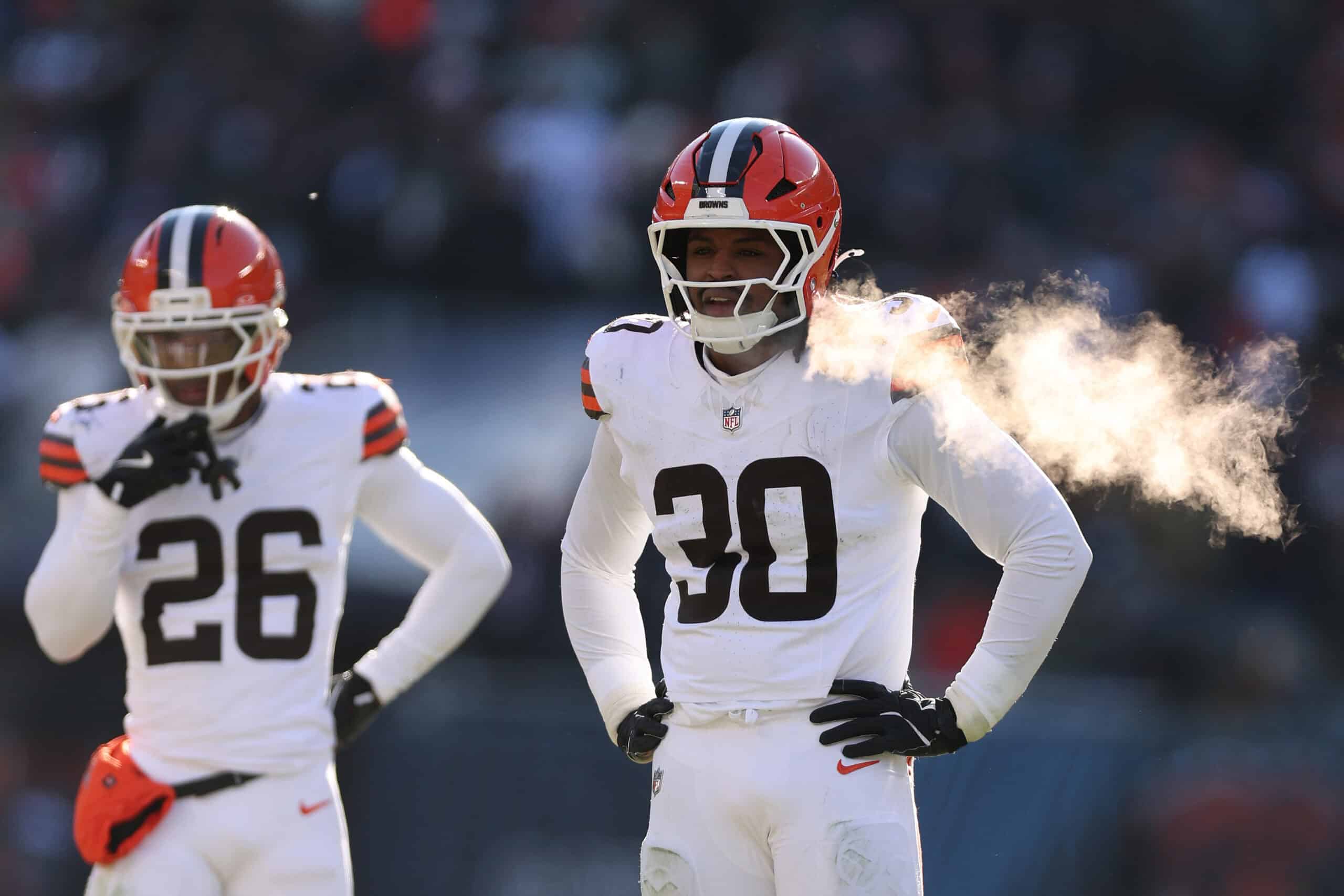 CHICAGO, ILLINOIS - DECEMBER 14: Myles Harden #26 and Devin Bush #30 of the Cleveland Browns look on against the Chicago Bears at Soldier Field on December 14, 2025 in Chicago, Illinois