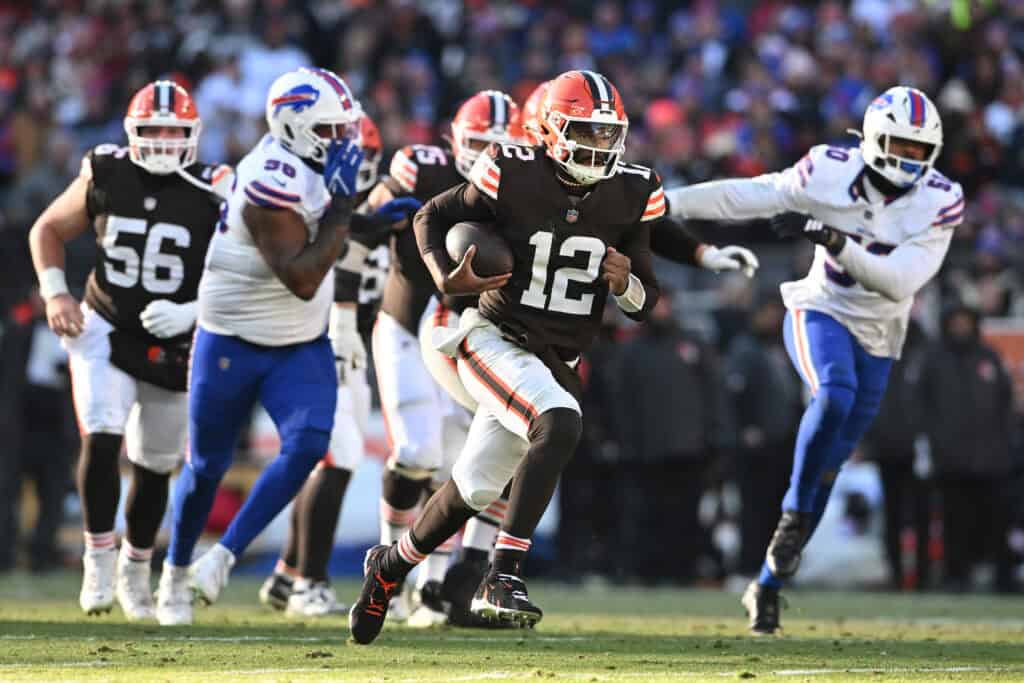 CLEVELAND, OHIO - DECEMBER 21: Shedeur Sanders #12 of the Cleveland Browns carries the ball against the defense of the Buffalo Bills in the third quarter of the game at Huntington Bank Field on December 21, 2025 in Cleveland, Ohio.
