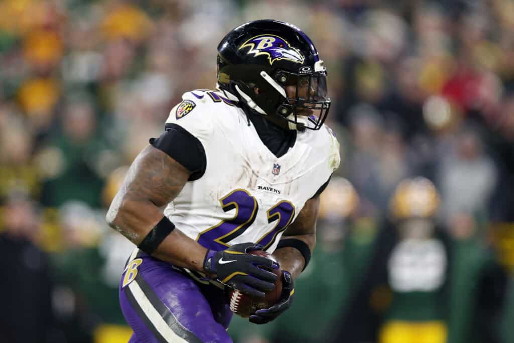 GREEN BAY, WISCONSIN - DECEMBER 27: Derrick Henry #22 of the Baltimore Ravens runs with the ball in the third quarter against the Green Bay Packers at Lambeau Field on December 27, 2025 in Green Bay, Wisconsin.