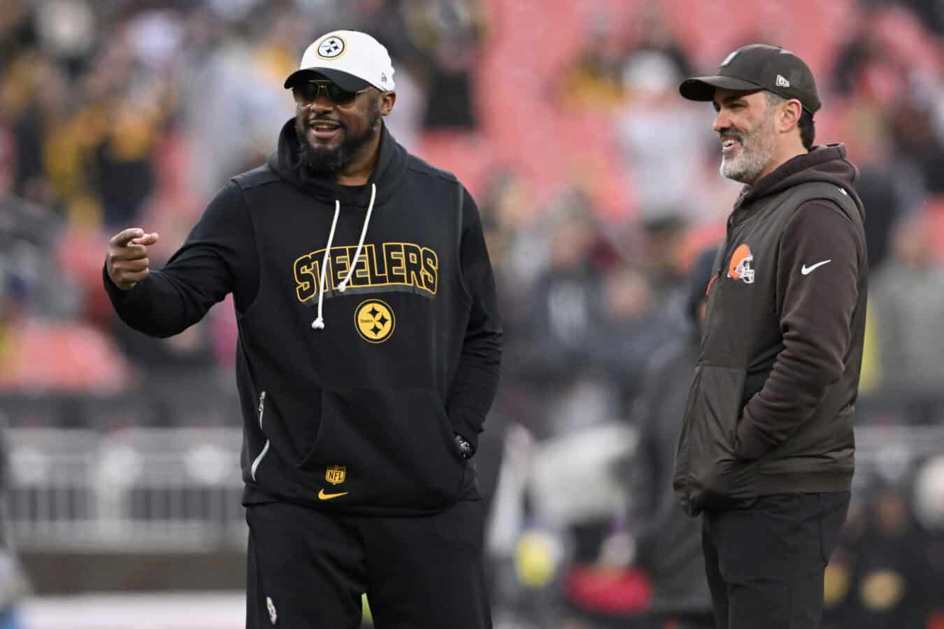 CLEVELAND, OHIO - DECEMBER 28: Head coach Mike Tomlin of the Pittsburgh Steelers and head coach Kevin Stefanski of the Cleveland Browns look on prior to the game at Huntington Bank Field on December 28, 2025 in Cleveland, Ohio.
