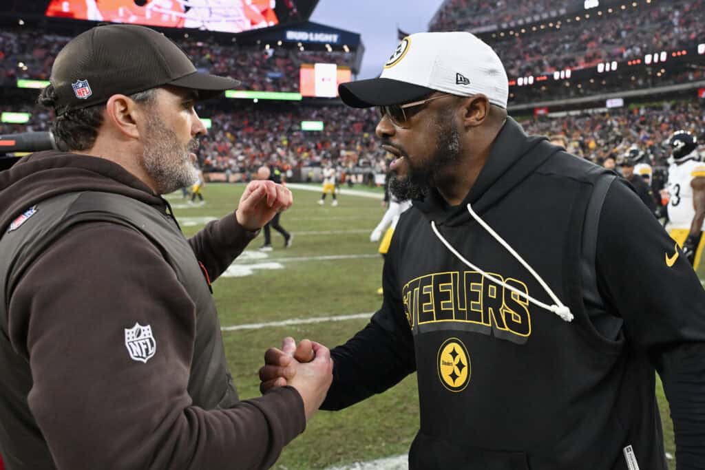 CLEVELAND, OHIO - DECEMBER 28: Head coach Kevin Stefanski of the Cleveland Browns and head coach Mike Tomlin of the Pittsburgh Steelers shake hands after the Cleveland Browns won the game at Huntington Bank Field on December 28, 2025 in Cleveland, Ohio.
