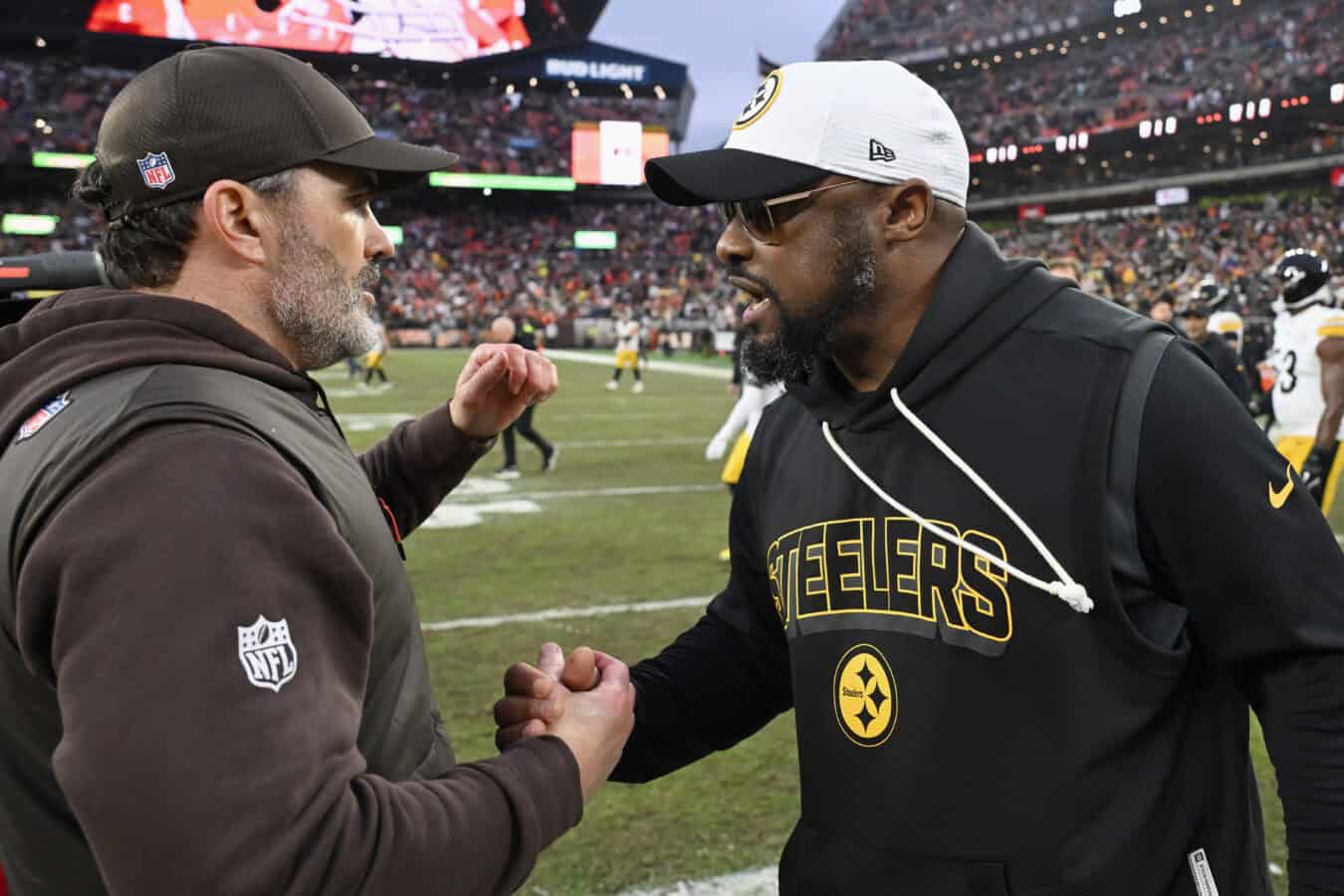 CLEVELAND, OHIO - DECEMBER 28: Head coach Kevin Stefanski of the Cleveland Browns and head coach Mike Tomlin of the Pittsburgh Steelers shake hands after the Cleveland Browns won the game at Huntington Bank Field on December 28, 2025 in Cleveland, Ohio.