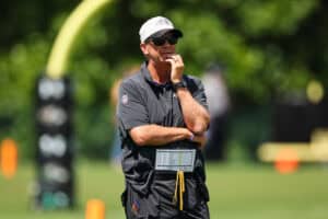 OWINGS MILLS, MD - AUGUST 12: Offensive Coordinator Todd Monken of the Baltimore Ravens looks on during training camp at Under Armour Performance Center Baltimore Ravens on August 12, 2024 in Owings Mills, Maryland.