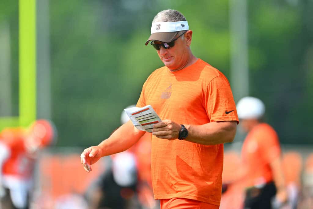 BEREA, OHIO - JULY 26: Defensive coordinator Jim Schwartz of the Cleveland Browns reviews his plays during training camp at CrossCountry Mortgage Campus on July 26, 2025 in Berea, Ohio.