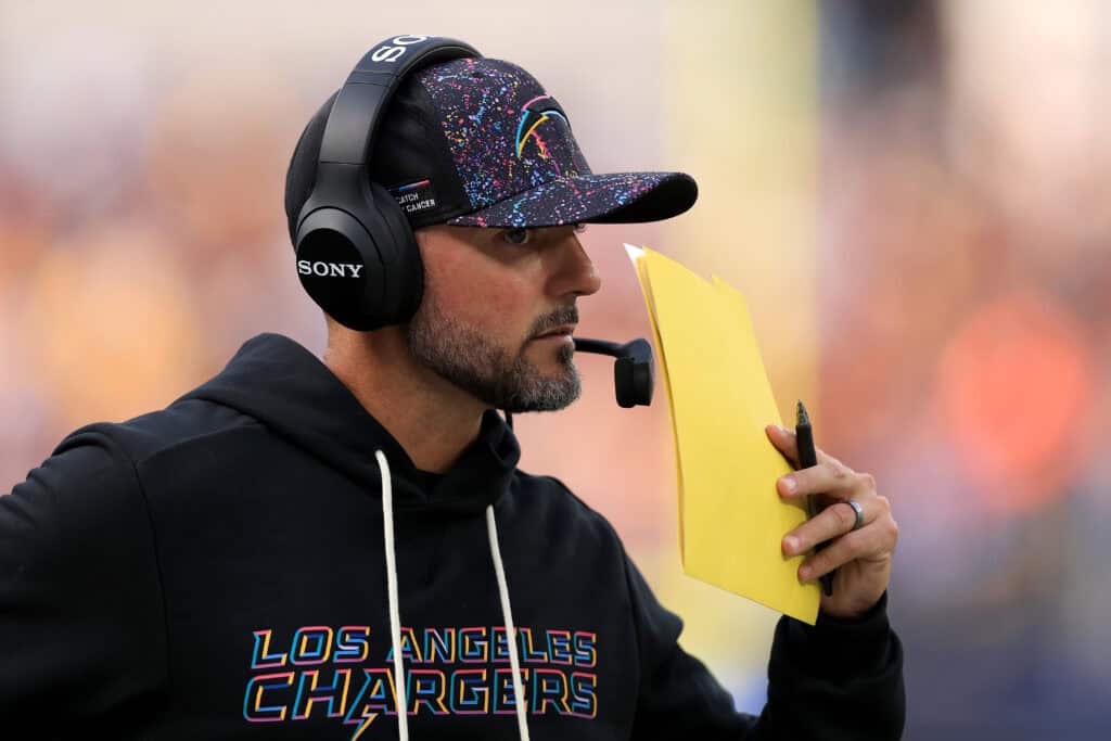 INGLEWOOD, CALIFORNIA - OCTOBER 05: Defensive coordinator Jesse Minter of the Los Angeles Chargers looks on against the Washington Commanders at SoFi Stadium on October 05, 2025 in Inglewood, California.