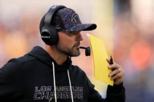 INGLEWOOD, CALIFORNIA - OCTOBER 05: Defensive coordinator Jesse Minter of the Los Angeles Chargers looks on against the Washington Commanders at SoFi Stadium on October 05, 2025 in Inglewood, California.