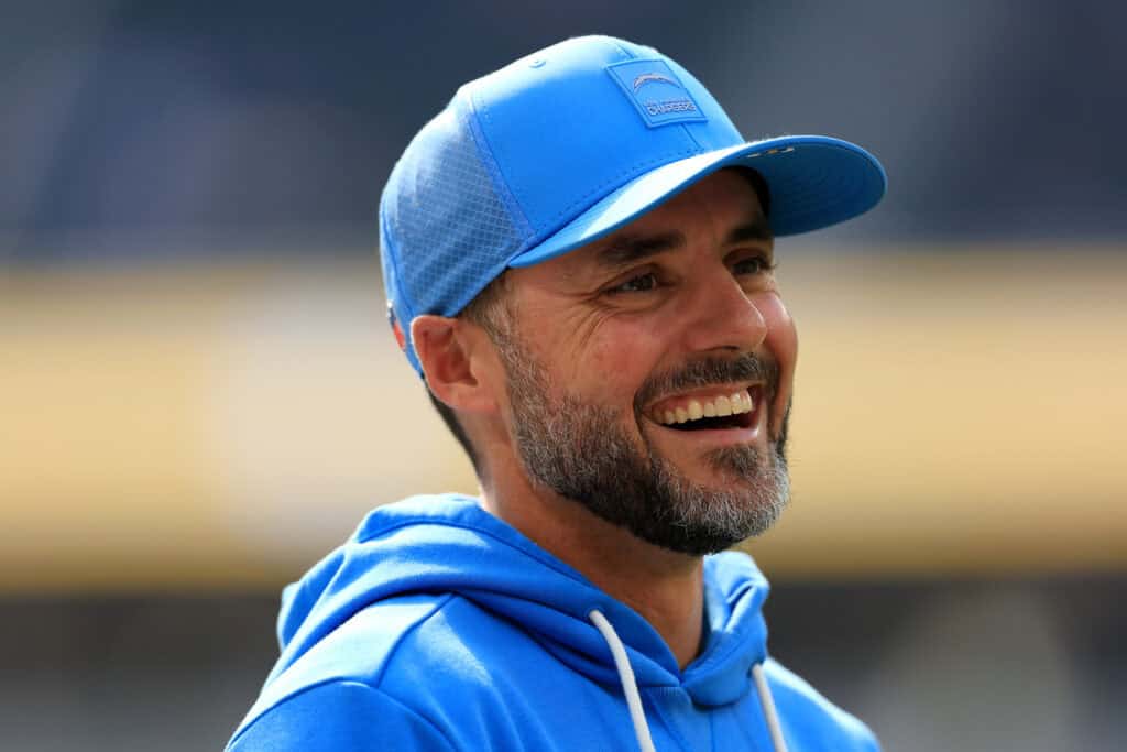 INGLEWOOD, CALIFORNIA - OCTOBER 19: Defensive coordinator Jesse Minter of the Los Angeles Chargers looks on before the game against the Indianapolis Colts at SoFi Stadium on October 19, 2025 in Inglewood, California.