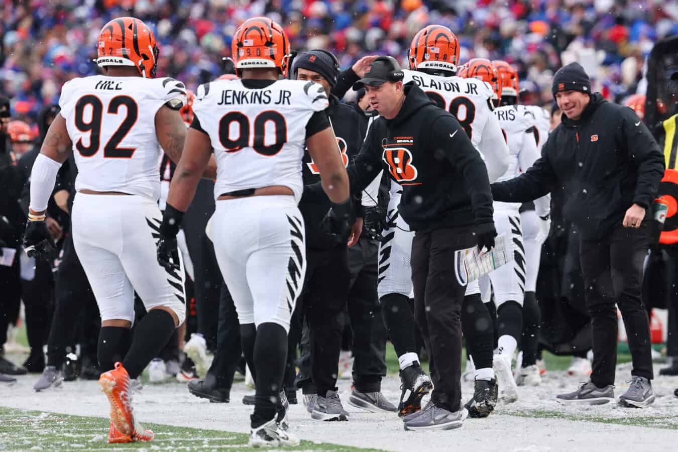 ORCHARD PARK, NEW YORK - DECEMBER 07: Head coach Zac Taylor of the Cincinnati Bengals high fives B.J. Hill #92 and Kris Jenkins Jr. #90 against the Buffalo Bills during the third quarter at Highmark Stadium on December 07, 2025 in Orchard Park, New York.