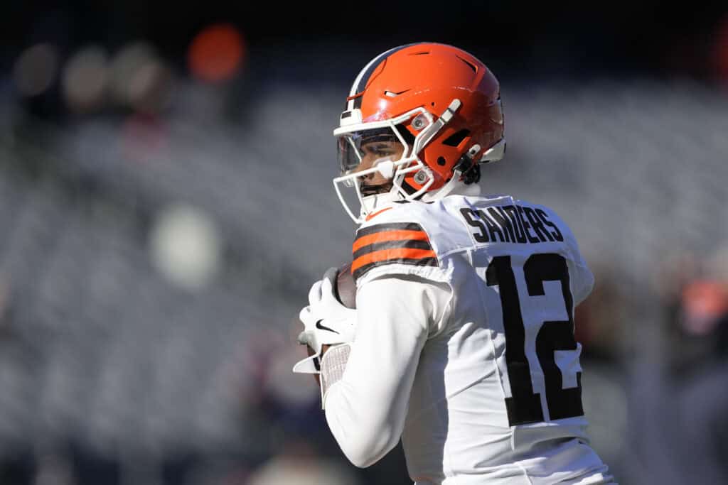 CHICAGO, ILLINOIS - DECEMBER 14: Shedeur Sanders #12 of the Cleveland Browns warms up prior to a game against the Chicago Bears at Soldier Field on December 14, 2025 in Chicago, Illinois.