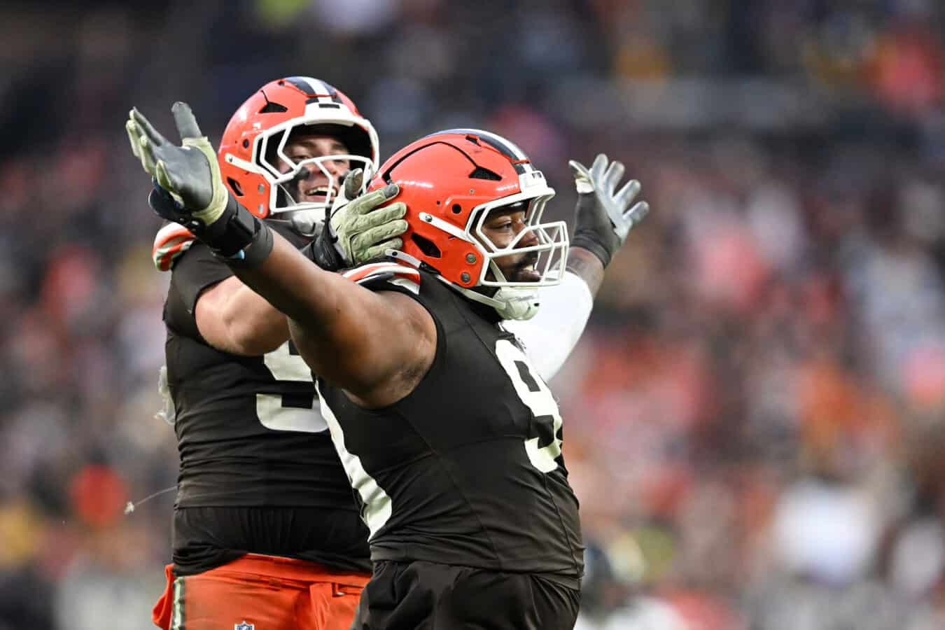 CLEVELAND, OHIO - DECEMBER 28: Mason Graham #94 and Shelby Harris #93 of the Cleveland Browns celebrates after a play against the Pittsburgh Steelers during the fourth quarter at Huntington Bank Field on December 28, 2025 in Cleveland, Ohio.