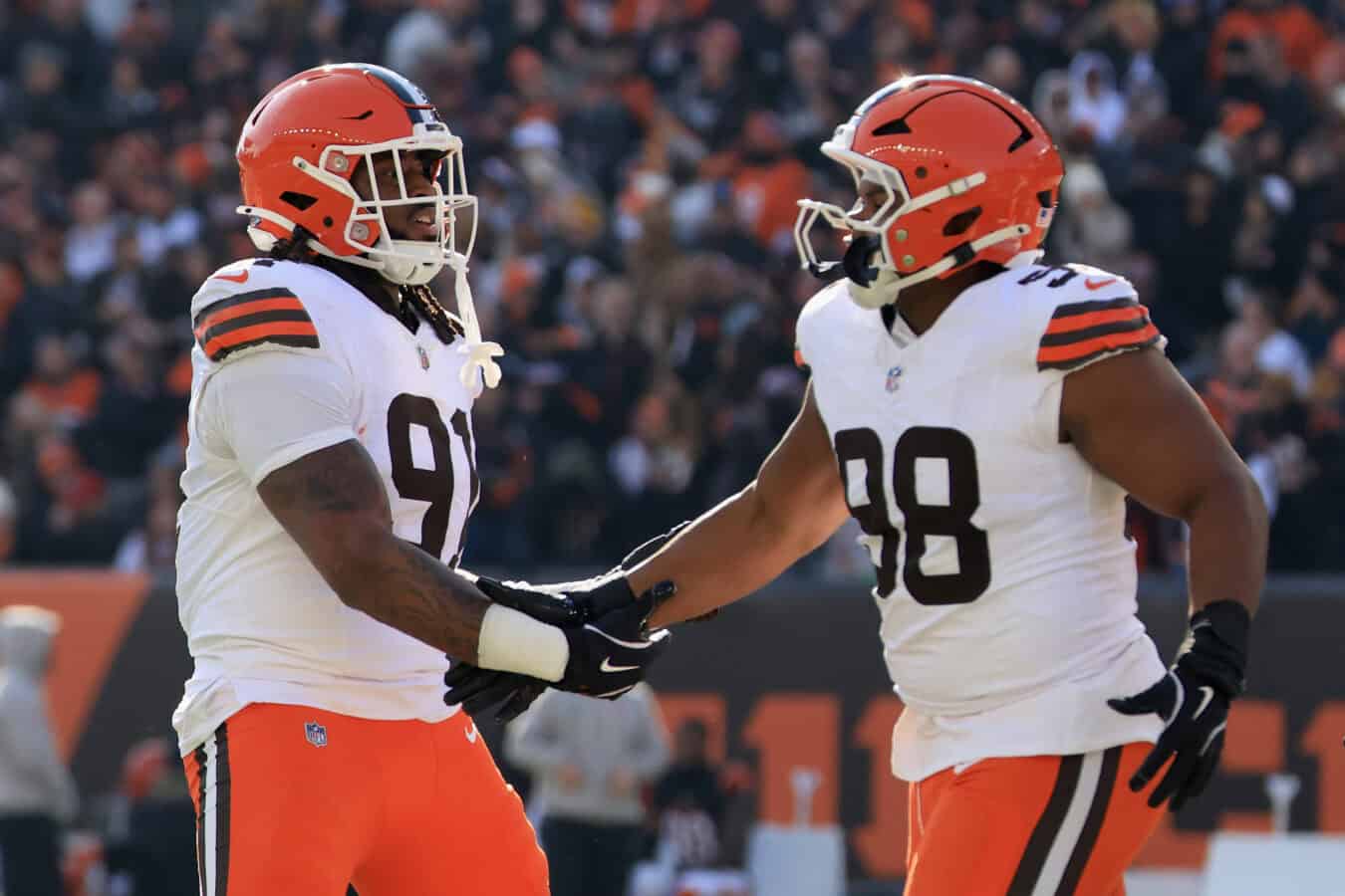 CINCINNATI, OHIO - JANUARY 04: Alex Wright #91 and Adin Huntington #98 of the Cleveland Browns react after a missed extra point for the Cincinnati Bengals during the first quarter at Paycor Stadium on January 04, 2026 in Cincinnati, Ohio.